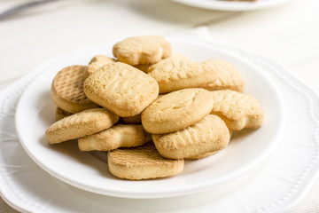 Sugar shortbread cookies in a white plate, close up