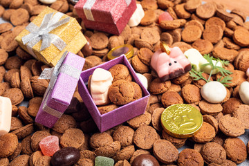 Dutch holiday Sinterklaas background with gift and pepernoten. Children's party concept with copy space.