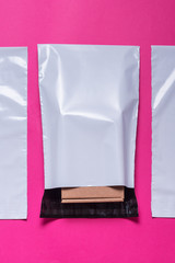 Set of polythene envelopes on pink background