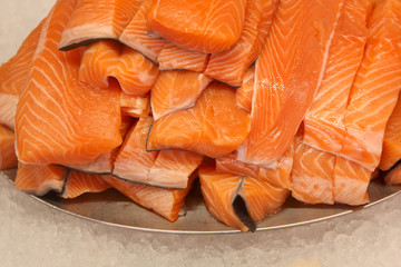 Cut fillet of red fish on the counter