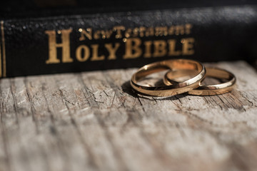 the bible is the base where upon two wedding rings rest