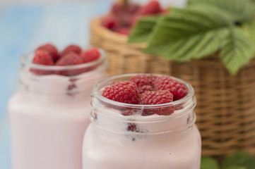 raspberry yogurt on a wooden background. 
