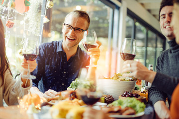 happiness friends christmas eve celebrate dinner party with food wine and laugh together with...