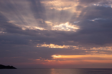 Fototapeta na wymiar Orange Cloudy Sunset on the Sea