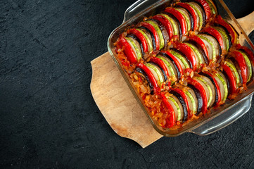Ratatouille - Traditional Dish Of Provencal Cuisine. Healthy Vegetable Food. Dark Stone Background