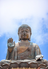 Fototapeta premium Tian Tan Buddha, Big Budda, The enormous Tian Tan Buddha at Po Lin Monastery in Hong Kong. The world's tallest outdoor seated bronze Buddha located in Nong ping 360.