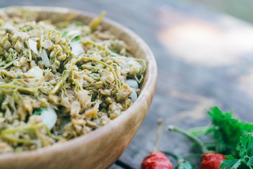 JONJOLI (Staphylea colchica, Caucasian bladdernut or Colchis bladdernut). Traditional Georgian food - pickled appetizer on a wooden table