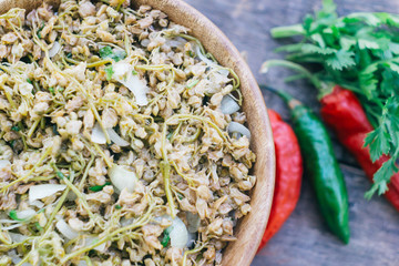 JONJOLI (Staphylea colchica, Caucasian bladdernut or Colchis bladdernut). Traditional Georgian food - pickled appetizer on a wooden table