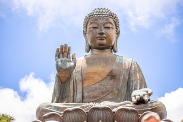 Fototapeta premium Tian Tan Buddha, Big Budda, The enormous Tian Tan Buddha at Po Lin Monastery in Hong Kong. The world's tallest outdoor seated bronze Buddha located in Nong ping 360.