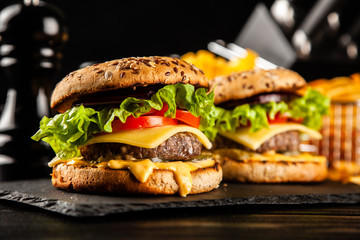 Delicious grilled burgers - obrazy, fototapety, plakaty