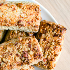 Cookies with nuts on a saucer. Food background
