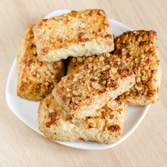 Cookies with nuts on a saucer. Food background
