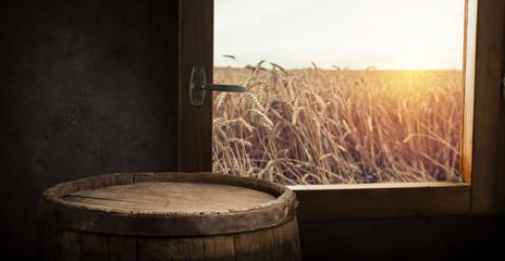 Beer barrel with beer glasses on table on wooden background