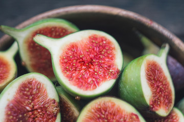 Some fresh red figs in a wooden bowl. Top view. Close up