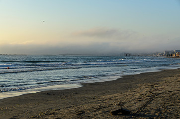 Fototapeta premium Beach of Black Sea from Mamaia, Romania at sunrise , warm sunshine atmosphere