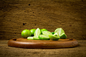 lime on choppping board wood on wood. wood background