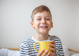 Boy with a mug of milk