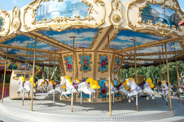 carousel in the recreation park, spinning in the carousel © Olga