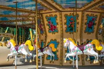 carousel in the recreation park, spinning in the carousel © Olga