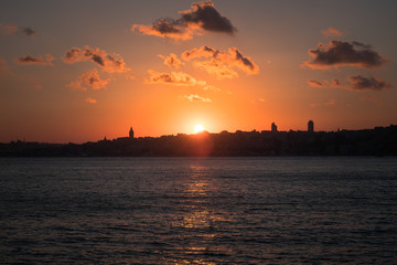 Panaromic View of Istanbul city and steamboats. Sunset in Galata Tower.