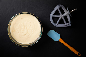 Dough for Baking Cupcake, Pie, Cake or Muffin. Prepare a test on a black background.Top View.Copy space for Text.selective focus.
