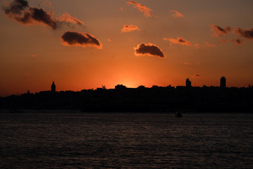 Panaromic View of Istanbul city and steamboats. Sunset in Galata Tower.