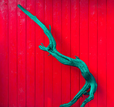 abstract turquoise dry tree on a red background