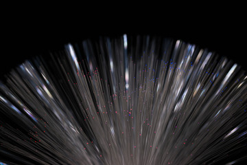 Optical fibres abstract background image on black background close up shot.