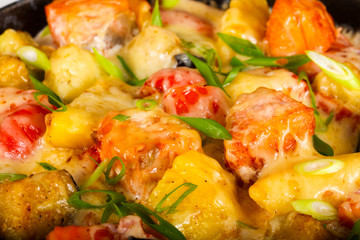 Baked salmon with potato in pan