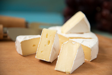 slices of cheese camembert on a cutting board