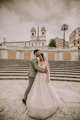 Young wedding couple on Spanish stairs in Rome