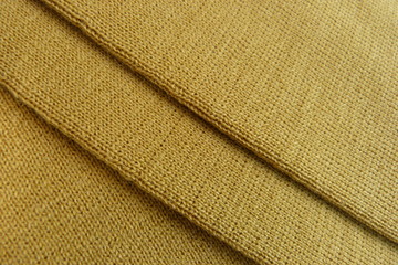 yellow knitted fabric close-up woolen cloth