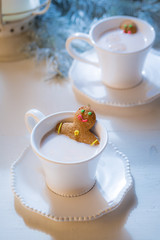 Sweet gingerbread man in hot chocolate for Christmas