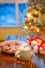 Adorable Christmas tree and gifts in old rustic house