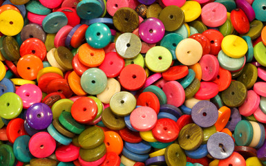 Fototapeta na wymiar background of colored ivory buttons
