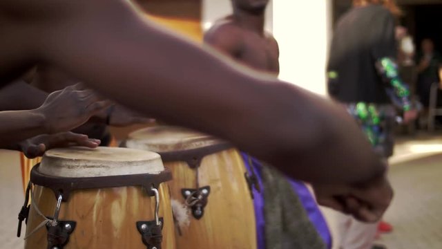 Black African plays on ethnic bamboo drums