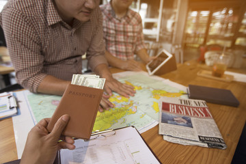 Business people are planning a trip after getting a profit from the investment.