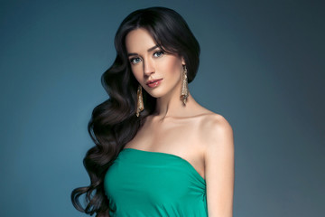 Fototapeta premium Beautiful hairstyle brunette long hair woman classic hairs curly