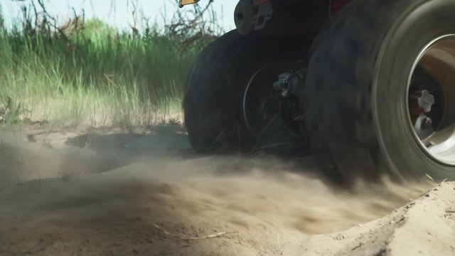 ATV skids in the sand