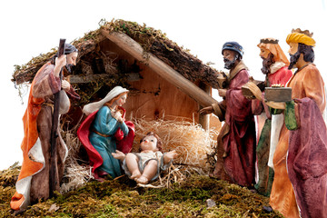 Christmas nativity scene with Holy Family in the hut and the three wise men, isolated on white...