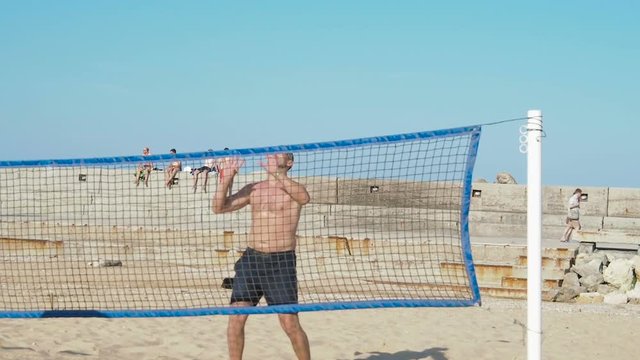 Volleyball on the beach. Paren plays volleyball.