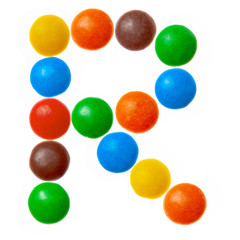 Letter R of sweet colored candies, alphabet isolated on white