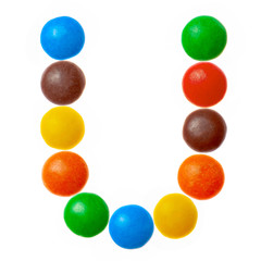 Letter U of sweet colored candies, alphabet isolated on white