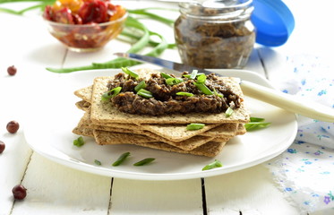 Mushroom pate and dried tomatoes with crackers, mousse