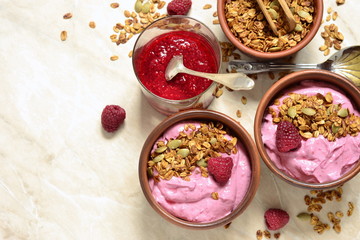 Raspberry smoothie with granola and pumpkin seeds