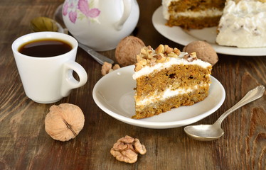 Homemade carrot cake with walnuts and cream