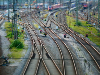 Tilt shift view on signal lights next to railway tracks