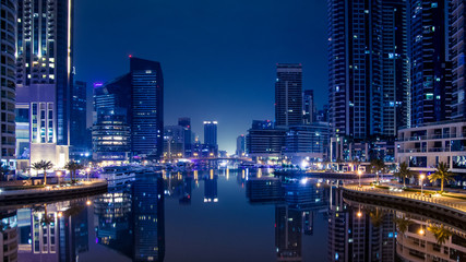 Fototapeta na wymiar Night scene in the Marina Dubai. Blue color cast.