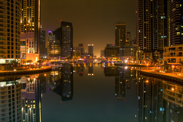 Fototapeta na wymiar Night scene in the Marina Dubai. Orange color cast.
