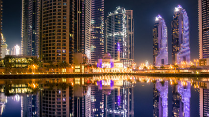 Fototapeta premium A view of a Mohammed Bin Ahmed Almulla Mosque. Night scene in the Dubai, Marina Dubai.